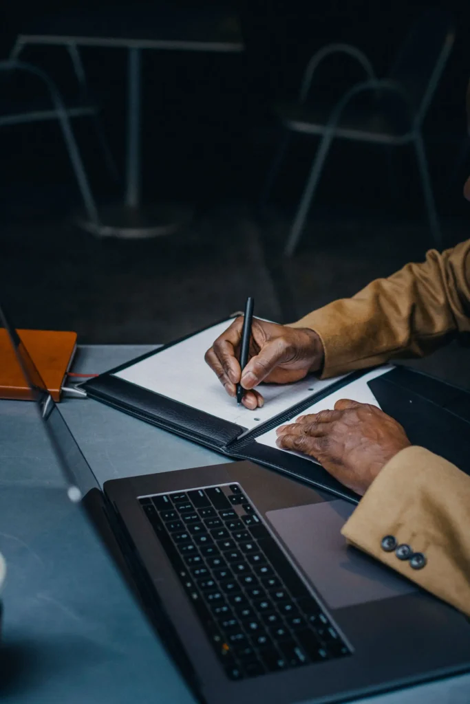 Small business owner planning website goals and customer journey on a laptop